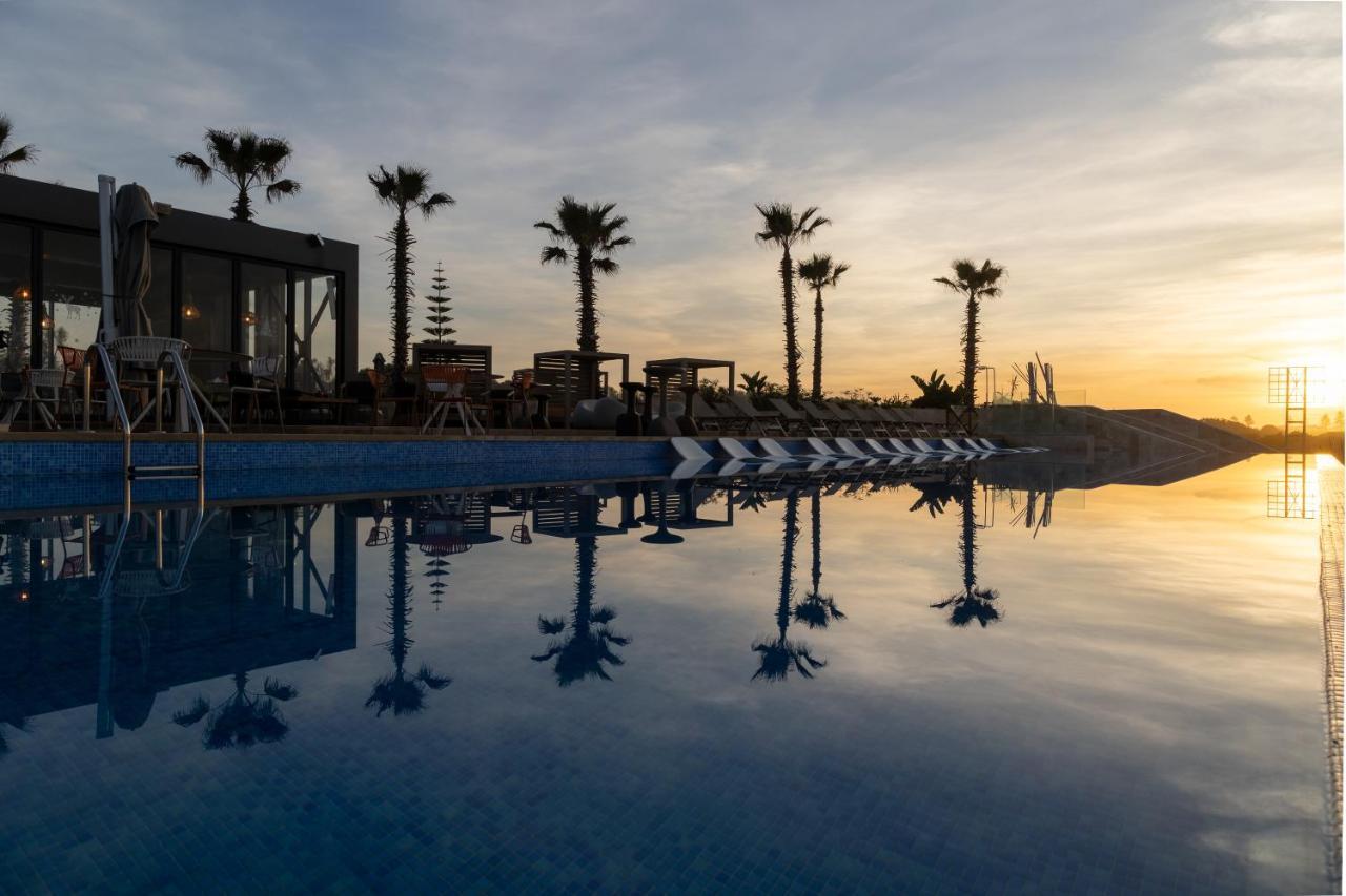 プルマン マガザン ロイヤル ゴルフ＆ スパ ホテル アル・ジャディーダ エクステリア 写真 Sunset at the pool