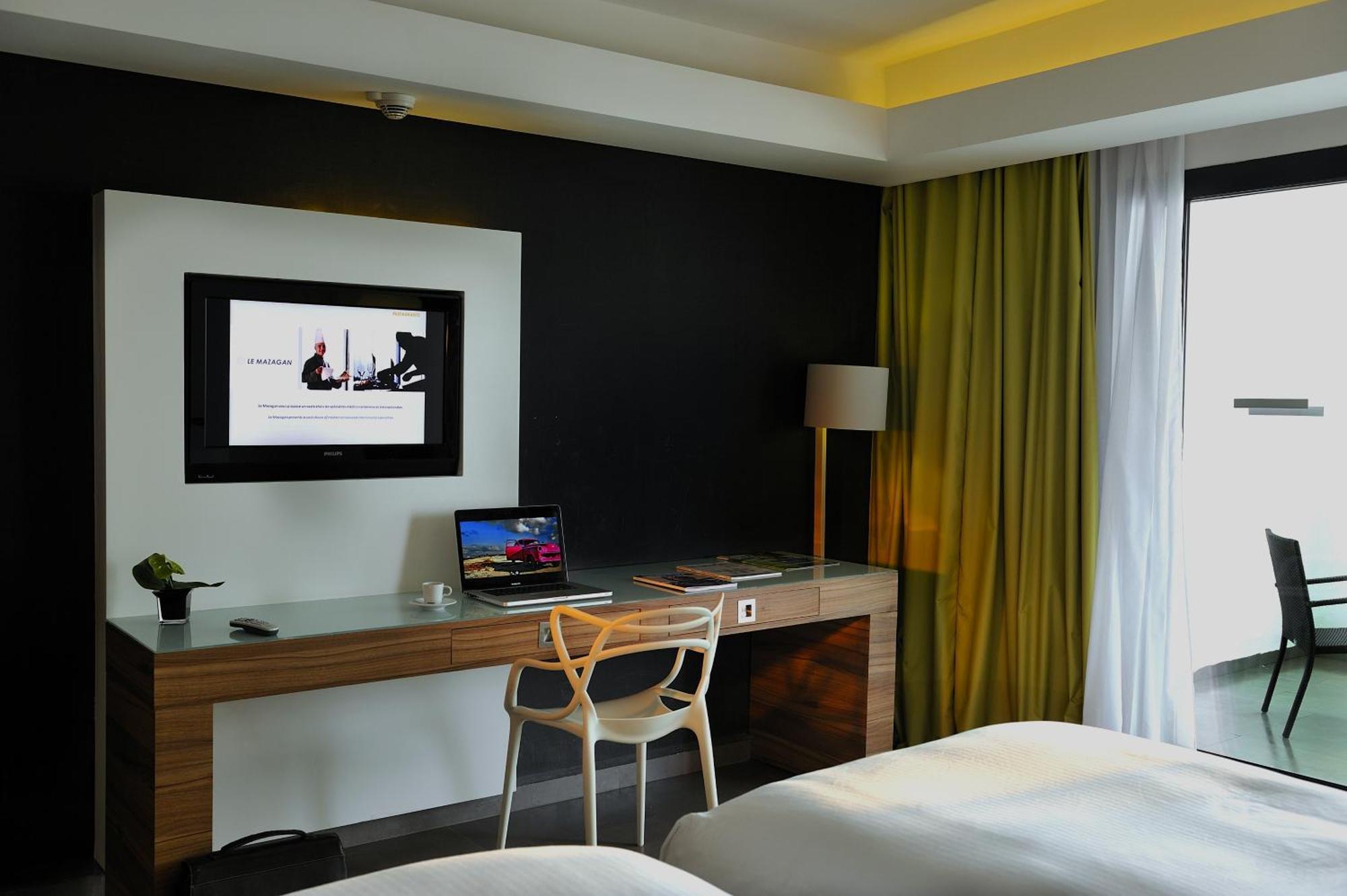 プルマン マガザン ロイヤル ゴルフ＆ スパ ホテル アル・ジャディーダ エクステリア 写真 A room at the hotel